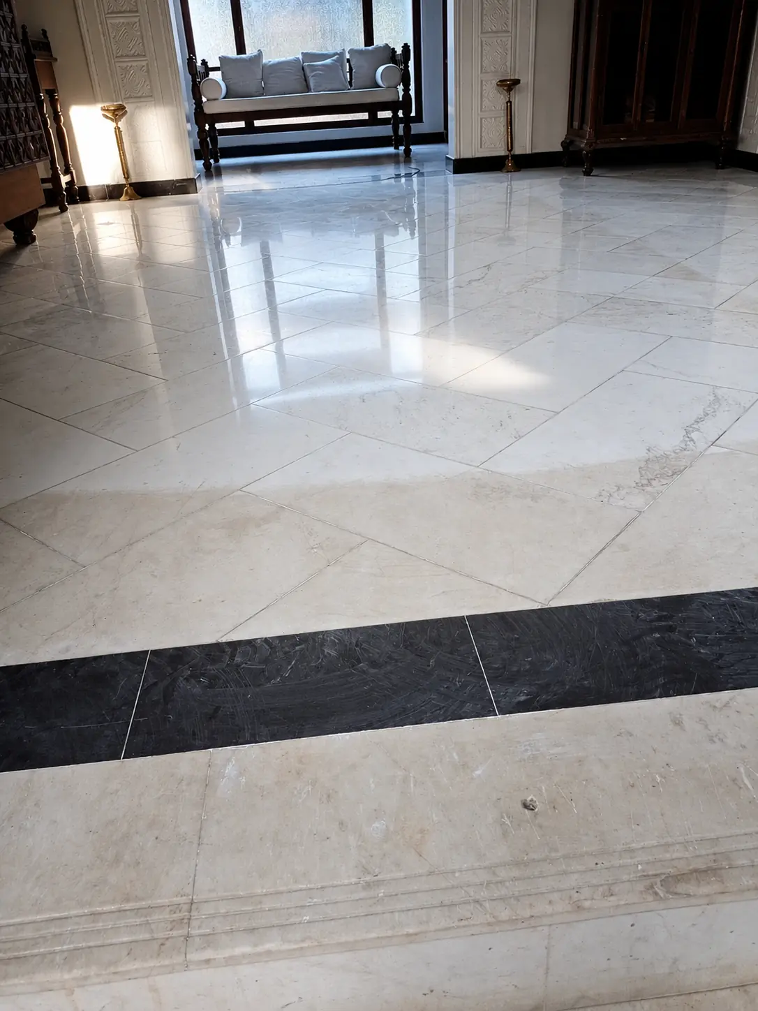 White stone tile lobby floor documented after professional surface care
