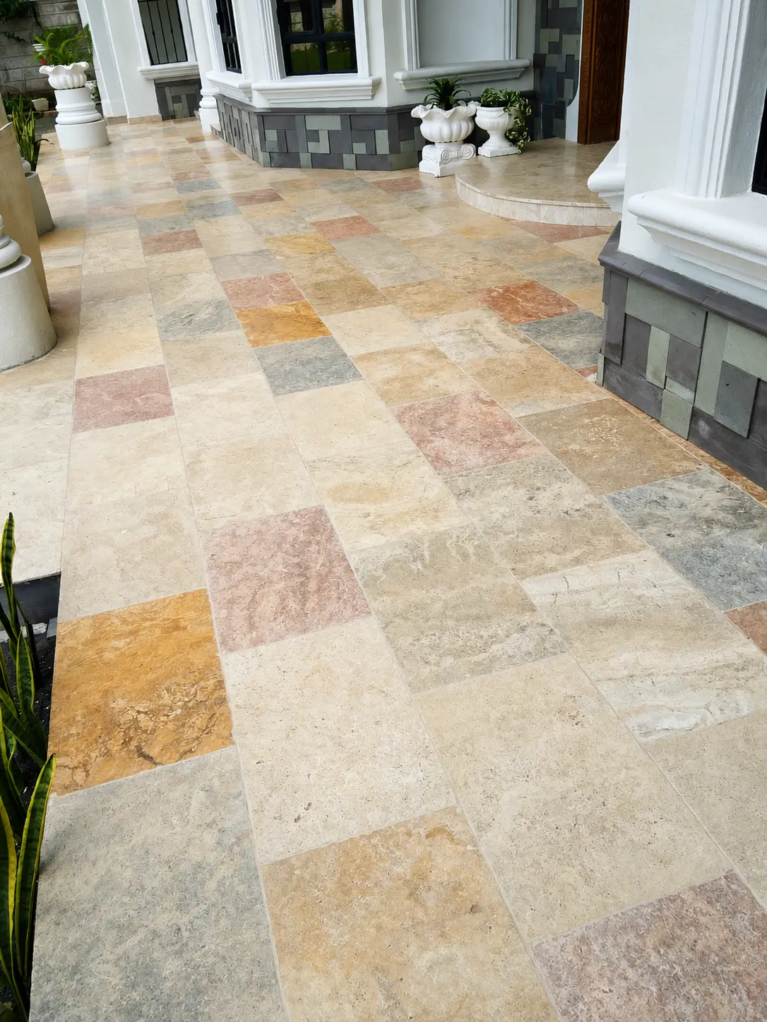 Multicolour natural stone walkway at a residential entrance